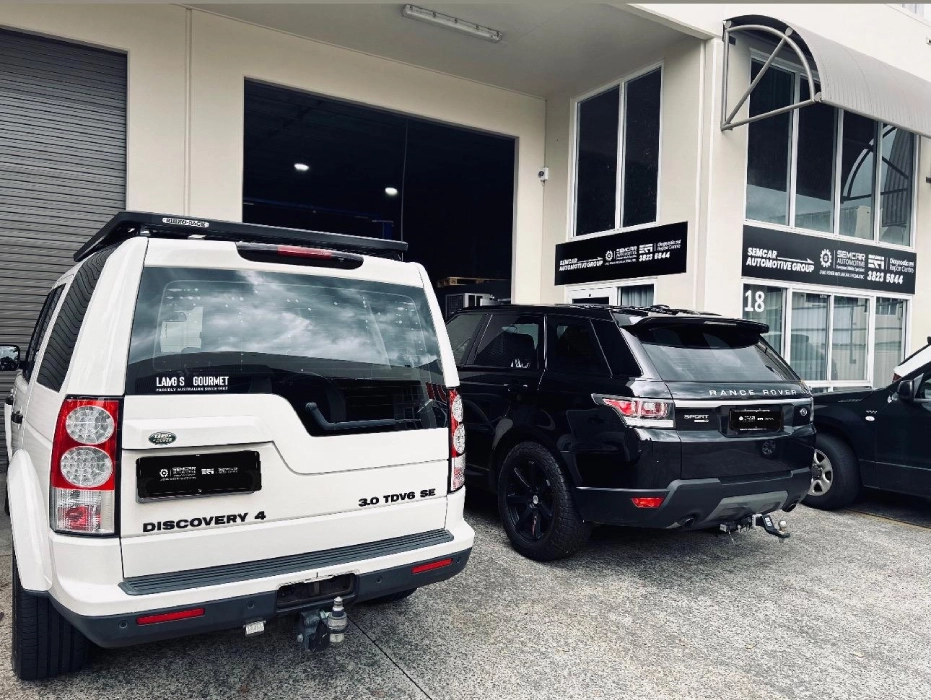 Land Rover and Range Rover vehicles inside SemCar Capalaba European car specialist workshop