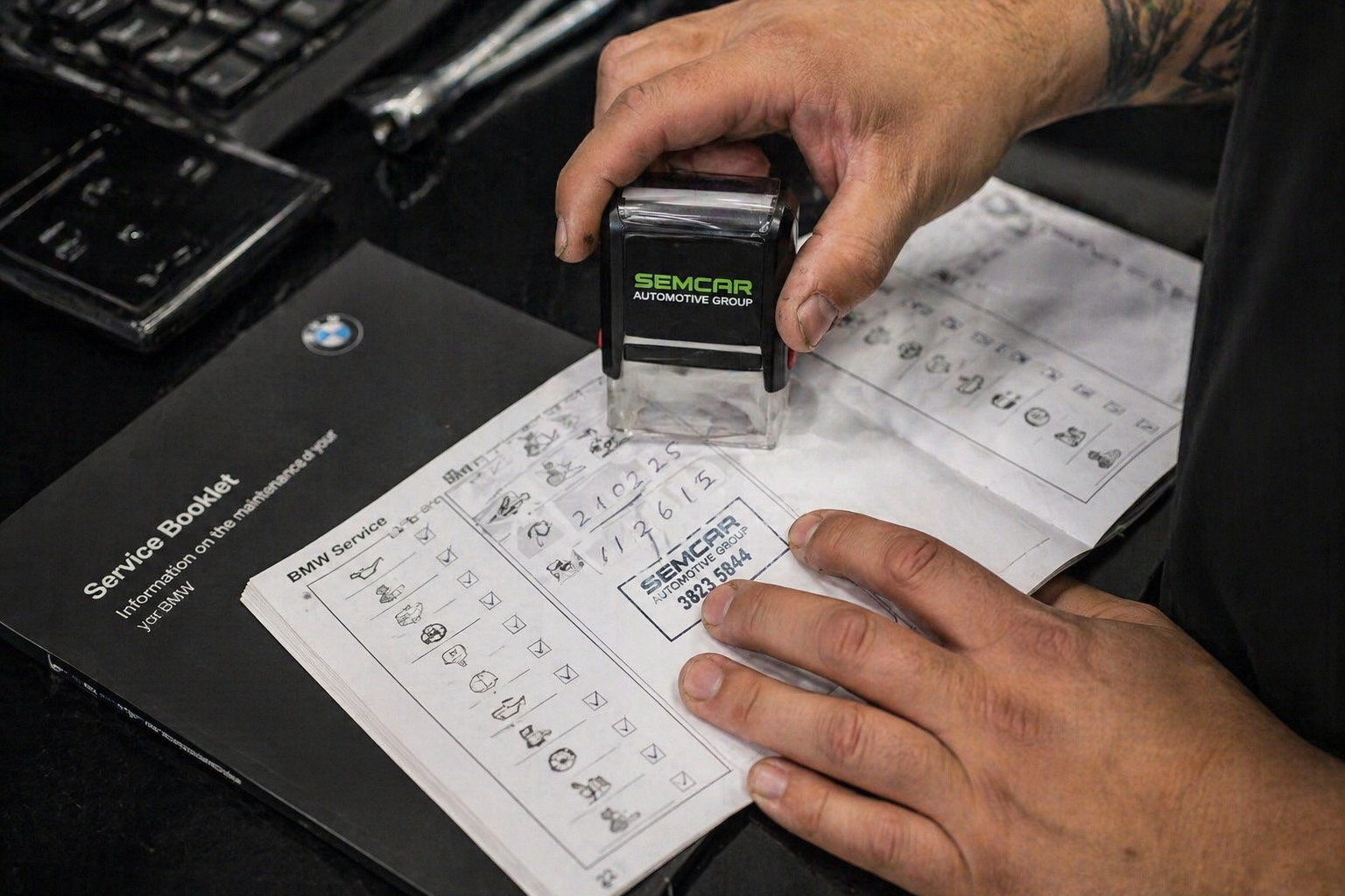 Service book stamp and electronic service record update at SemCar Brisbane logbook workshop