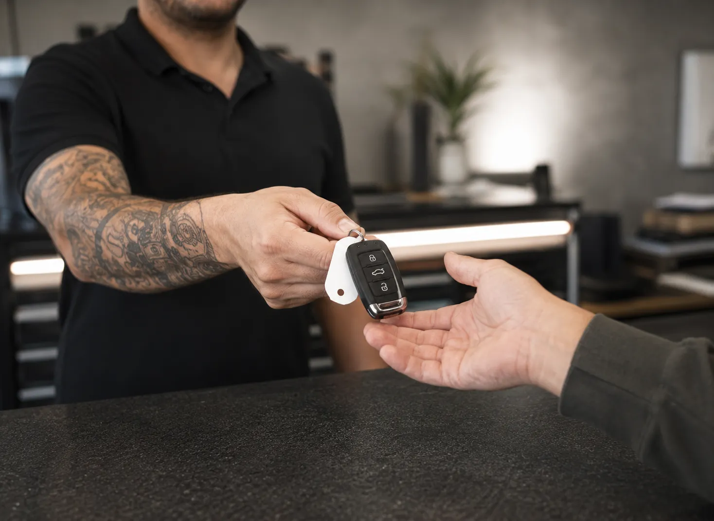 Car Key Replacement Handover | SemCar Capalaba Redlands Customer receiving a programmed replacement car key at SemCar's Capalaba reception