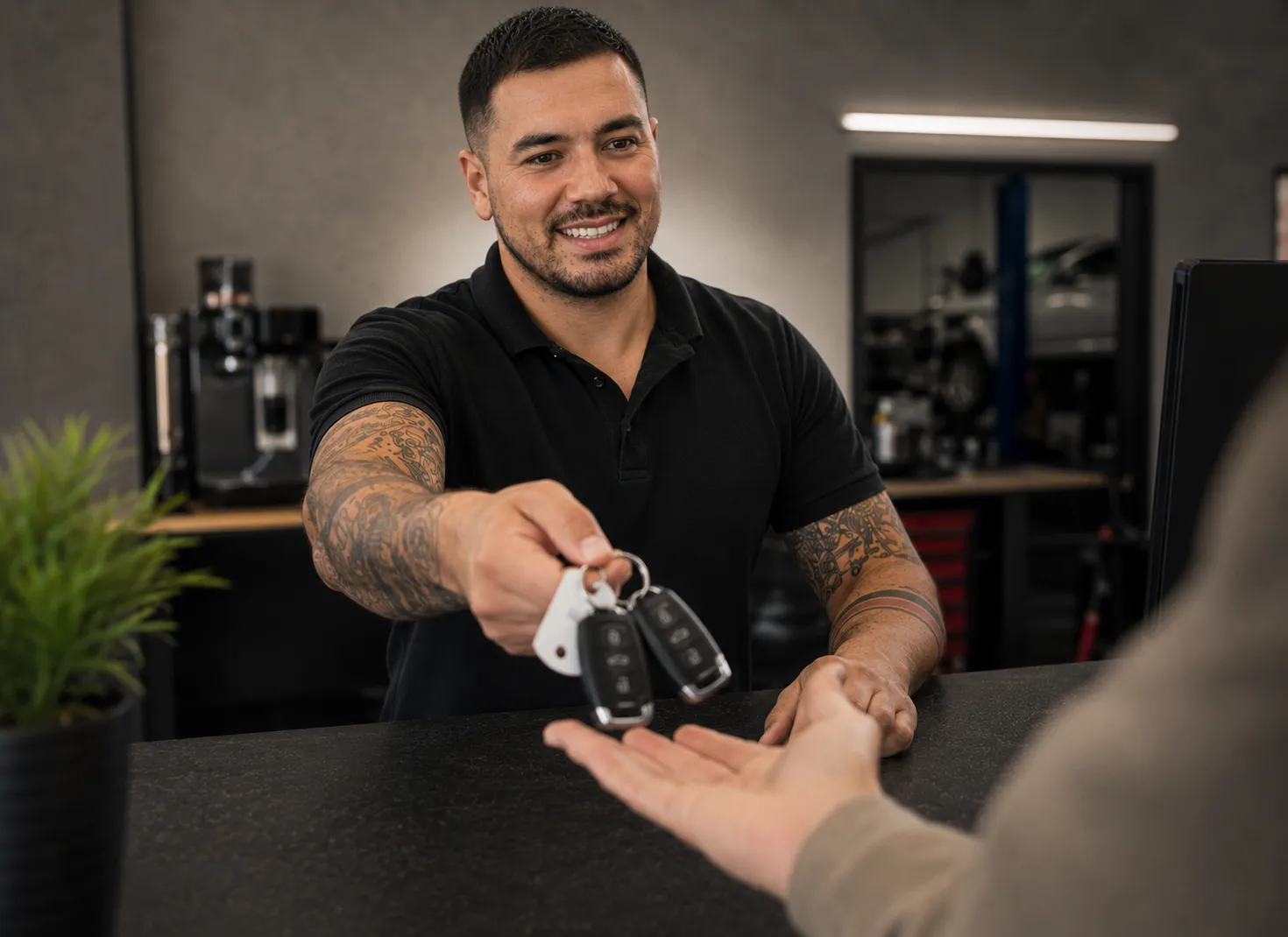 Spare Key Handover | SemCar Capalaba Redlands Customer receiving original and spare European car keys at SemCar Capalaba in the Redlands
