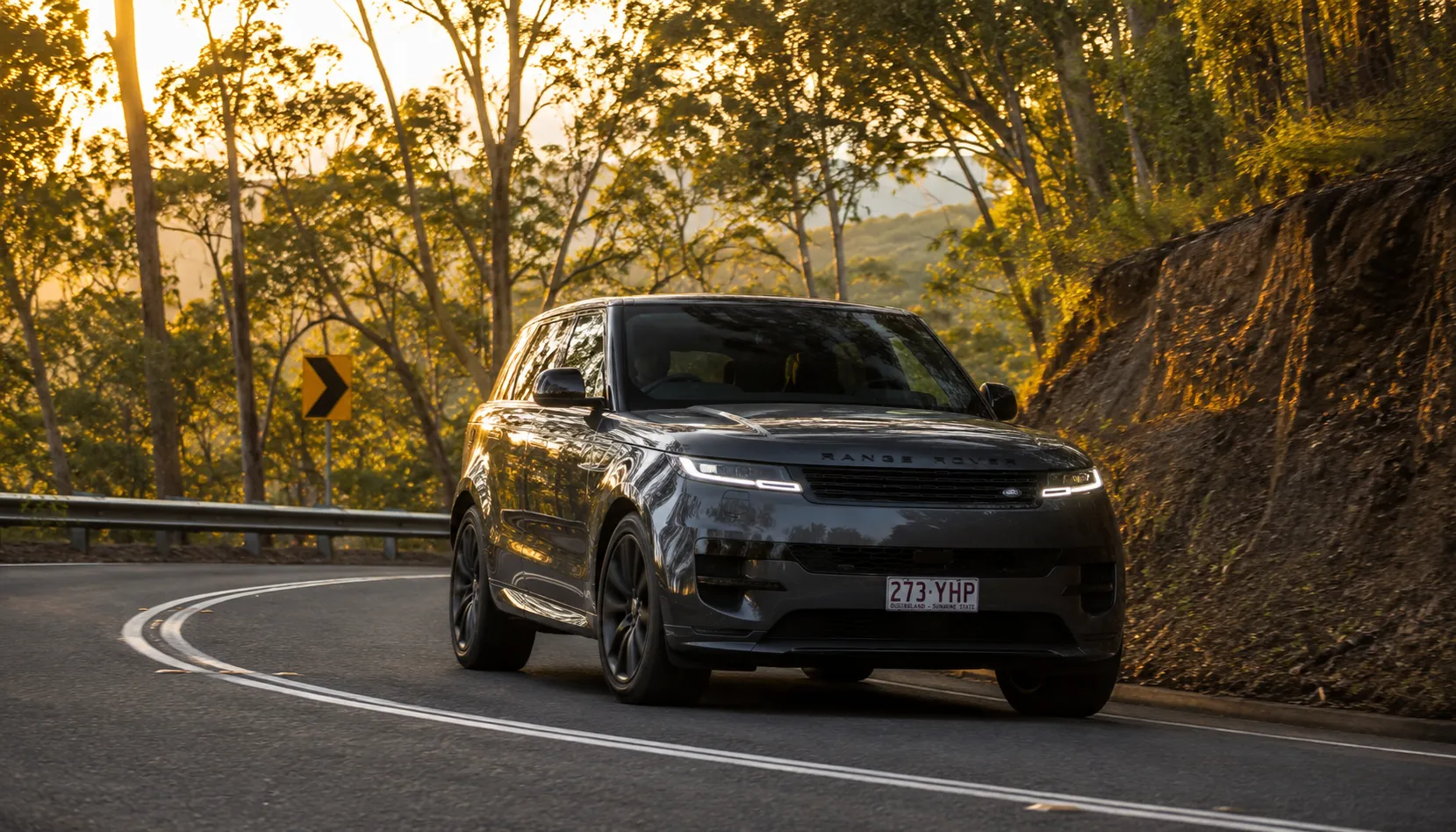 Meet Your Vehicle's Sportier Self Range Rover Sport cornering on a Queensland road after Dynamic Mode activation in Brisbane