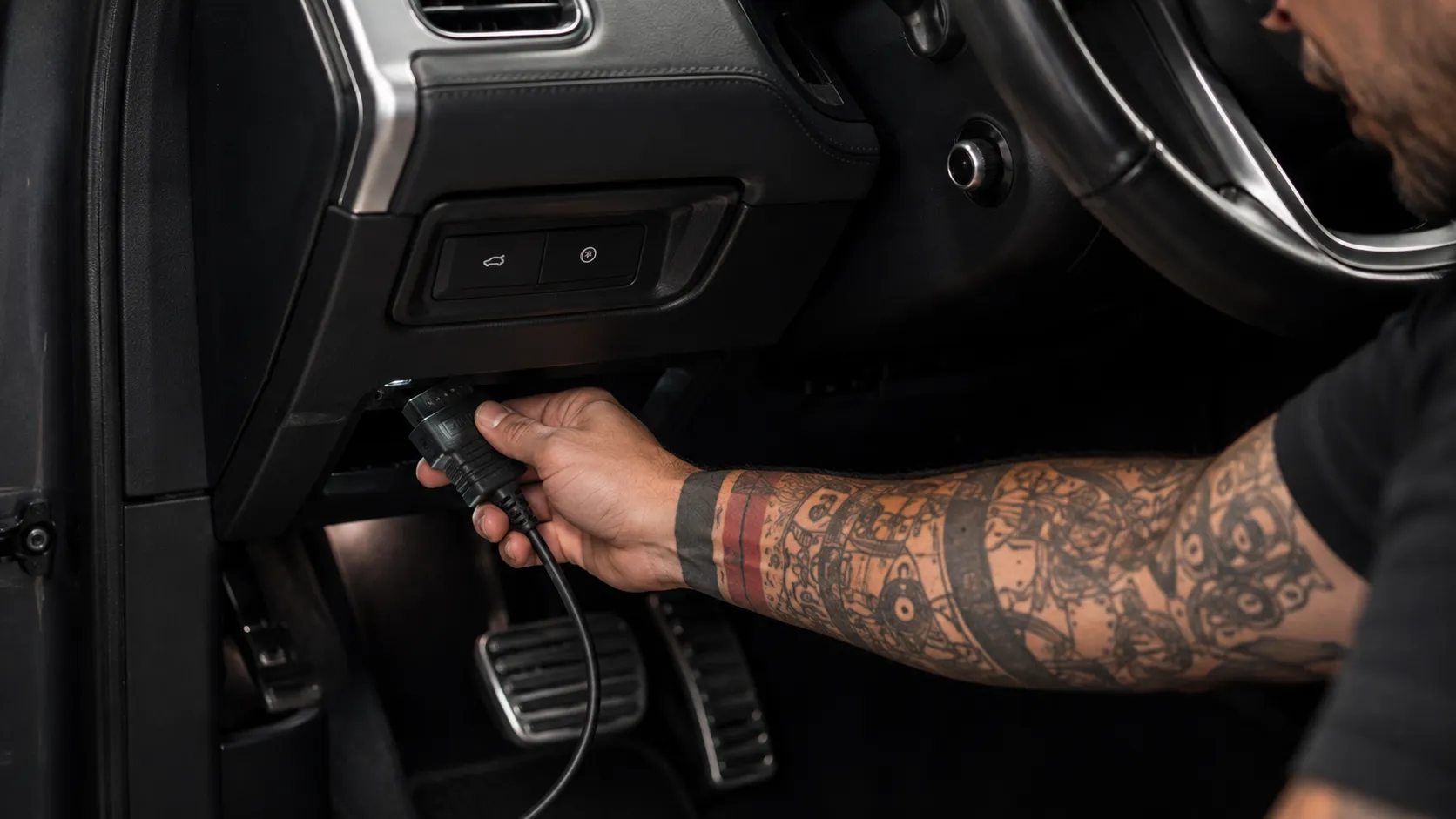 Reversible By Design Diagnostic connector plugged into a Land Rover OBD port for reversible coding in Brisbane