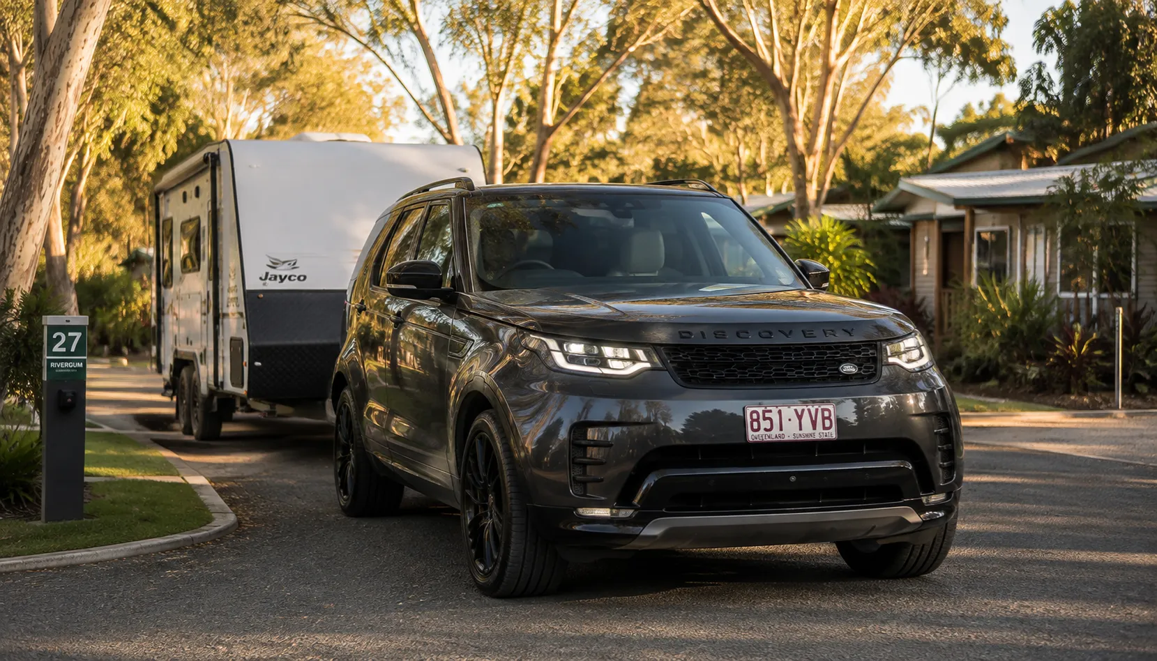 Built for Queensland Towing Land Rover Discovery reversing a caravan into a site using tow assist in Queensland