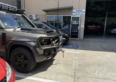 Land Rover Defender with roof rack parked outside the SemCar and Euro-Aus office at 128 Steel Street Capalaba