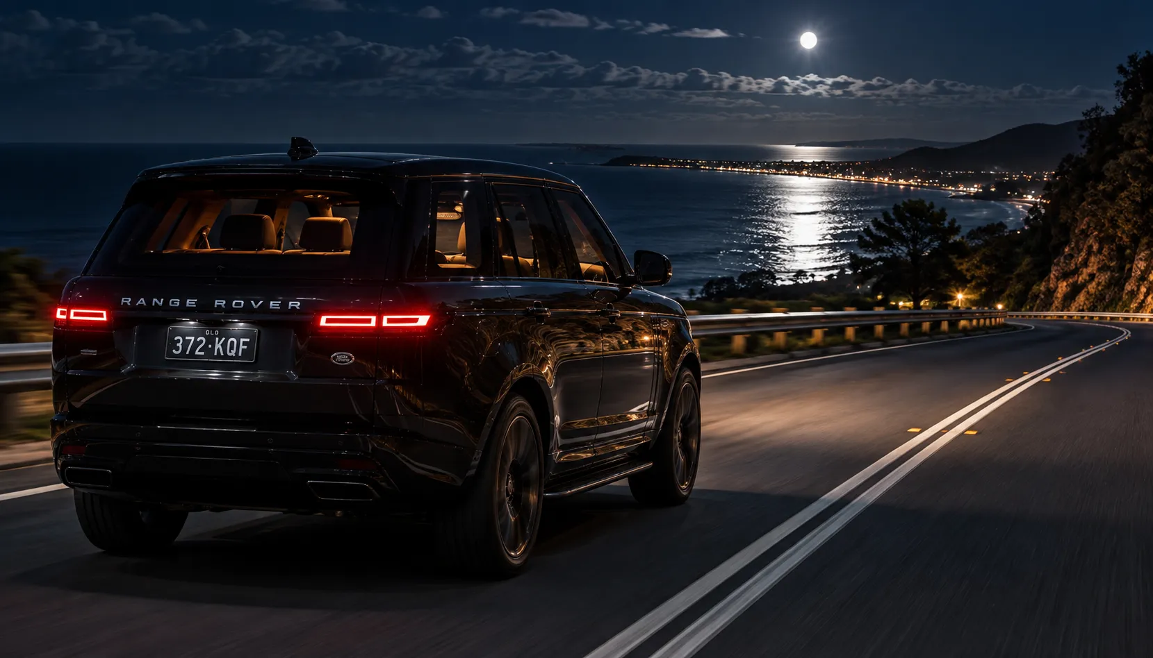 Range Rover with Meridian surround sound on a Queensland coastal road at night