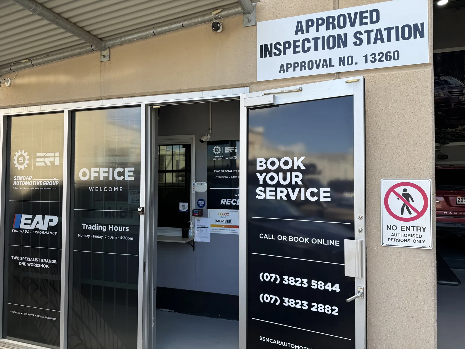 Reception and Approved Inspection Station SemCar and Euro-Aus reception entrance at 128 Steel Street Capalaba with the Approved Inspection Station sign