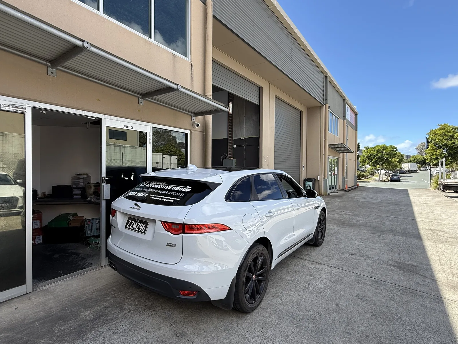 SemCar Unit 2 entrance SemCar Automotive Group Unit 2 entrance at 128 Steel Street Capalaba with a Jaguar F-Pace outside